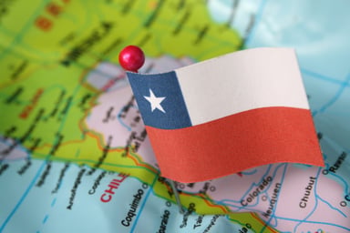 Chilean flag pin marks Santiago on a map of Chile