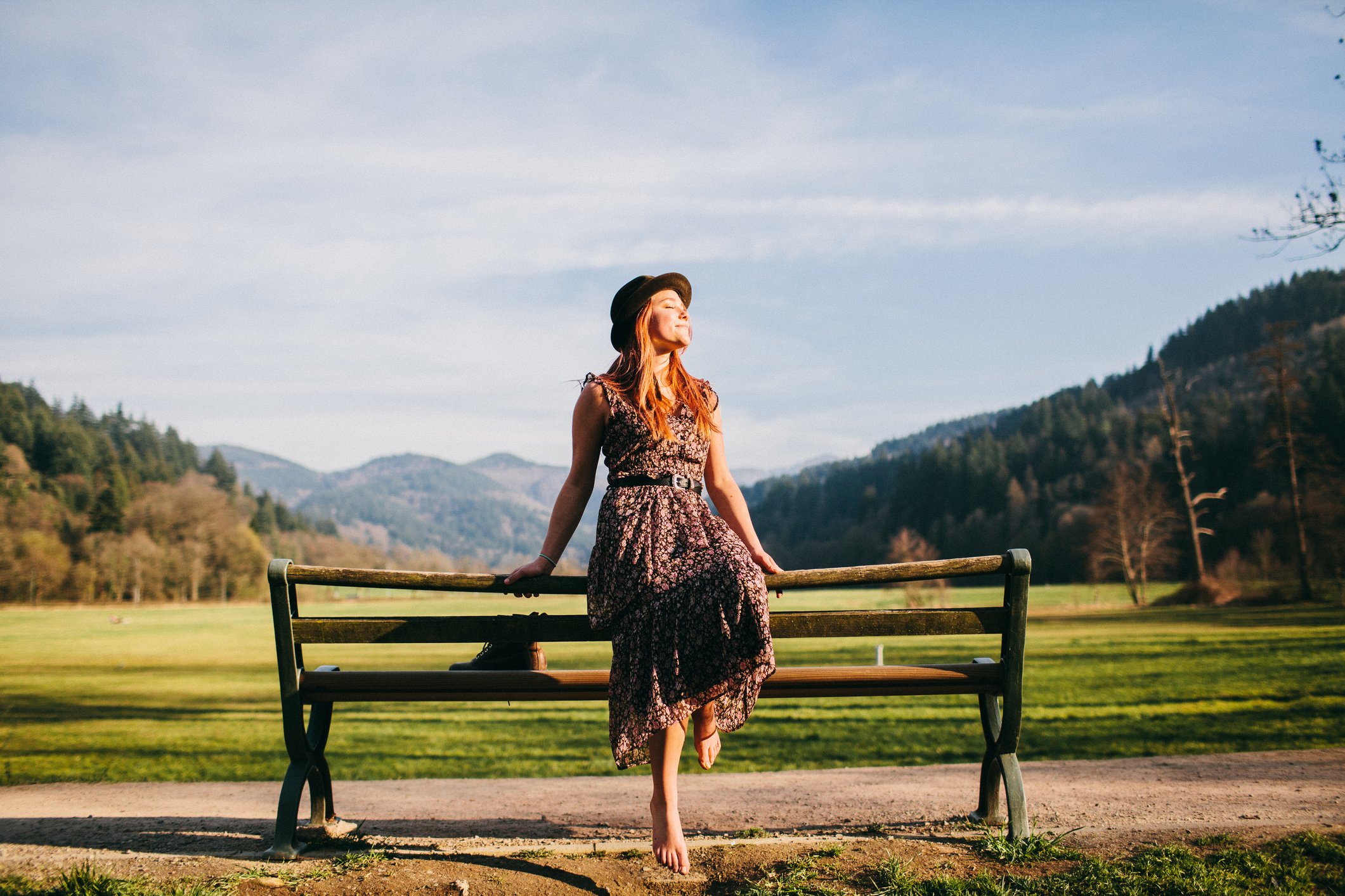 Young woman on park bench on a Spring day.