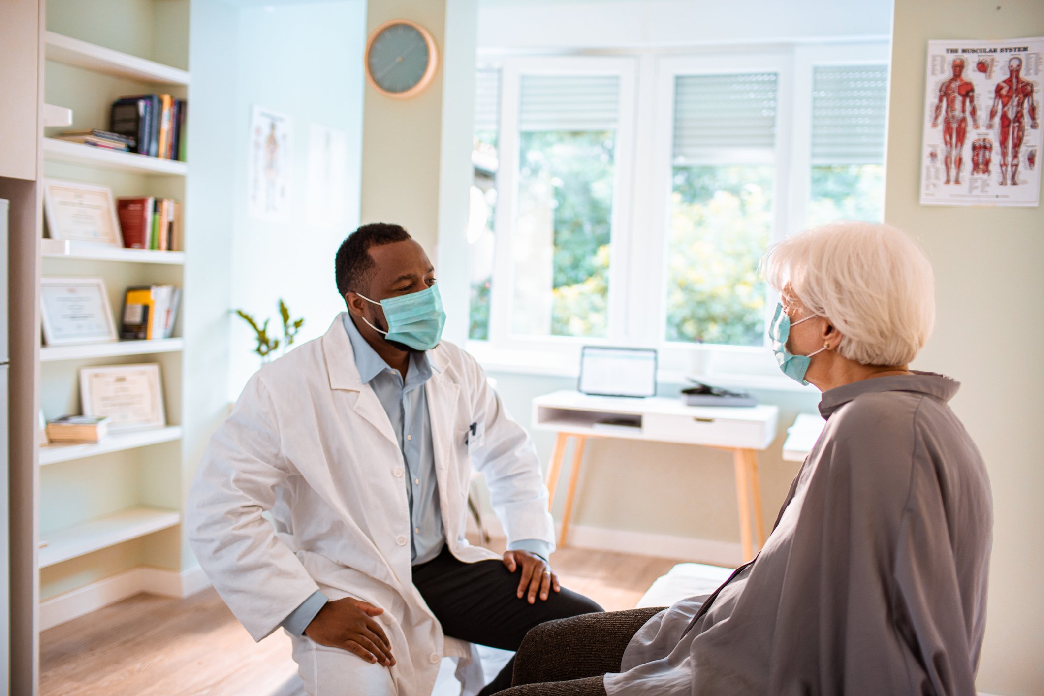 Patient conferring with a doctor.