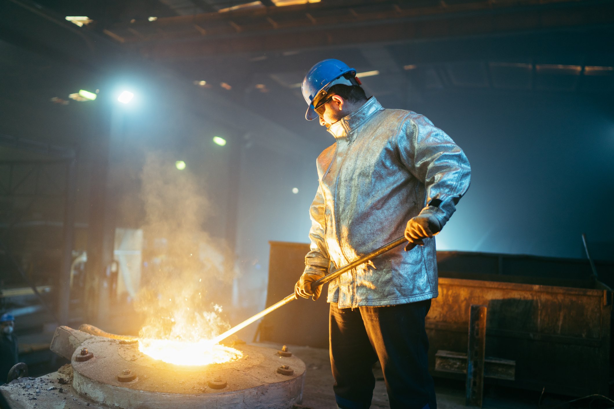 steelworker-protective-clothing-raking-furnace