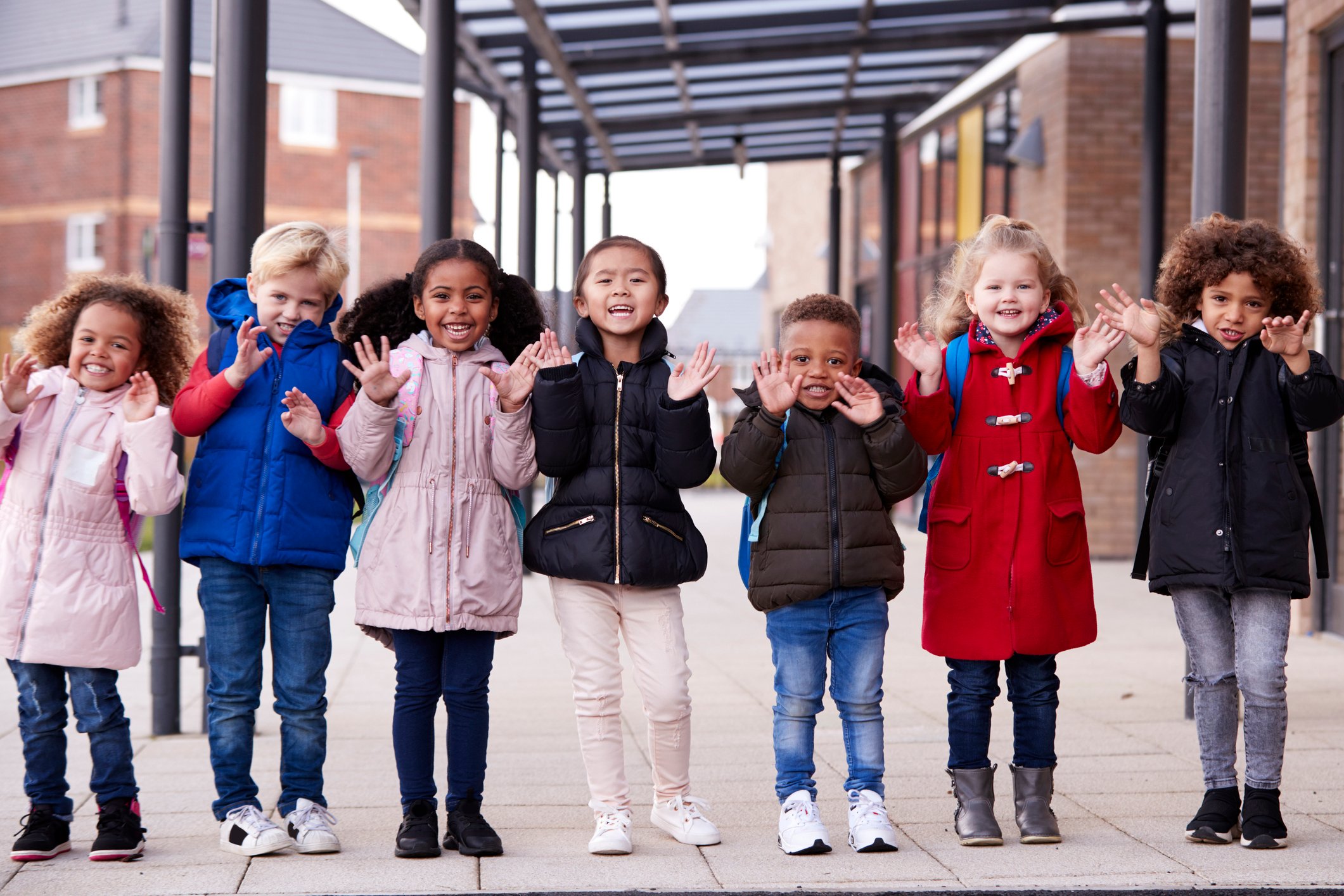 Children standing in a line holding hands
