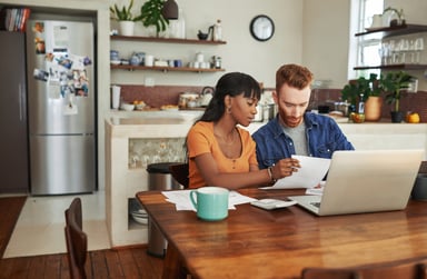 young couple looking over finances