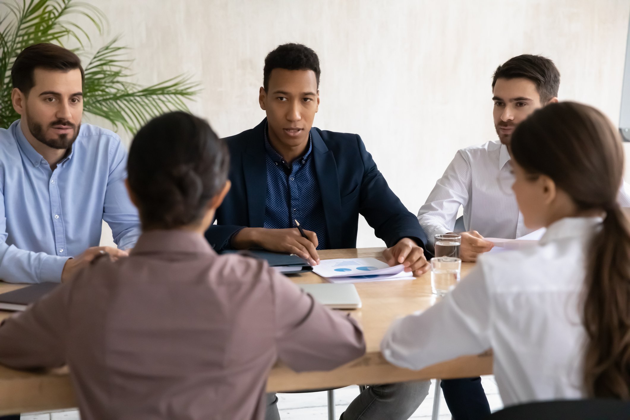 five investors sit at a table