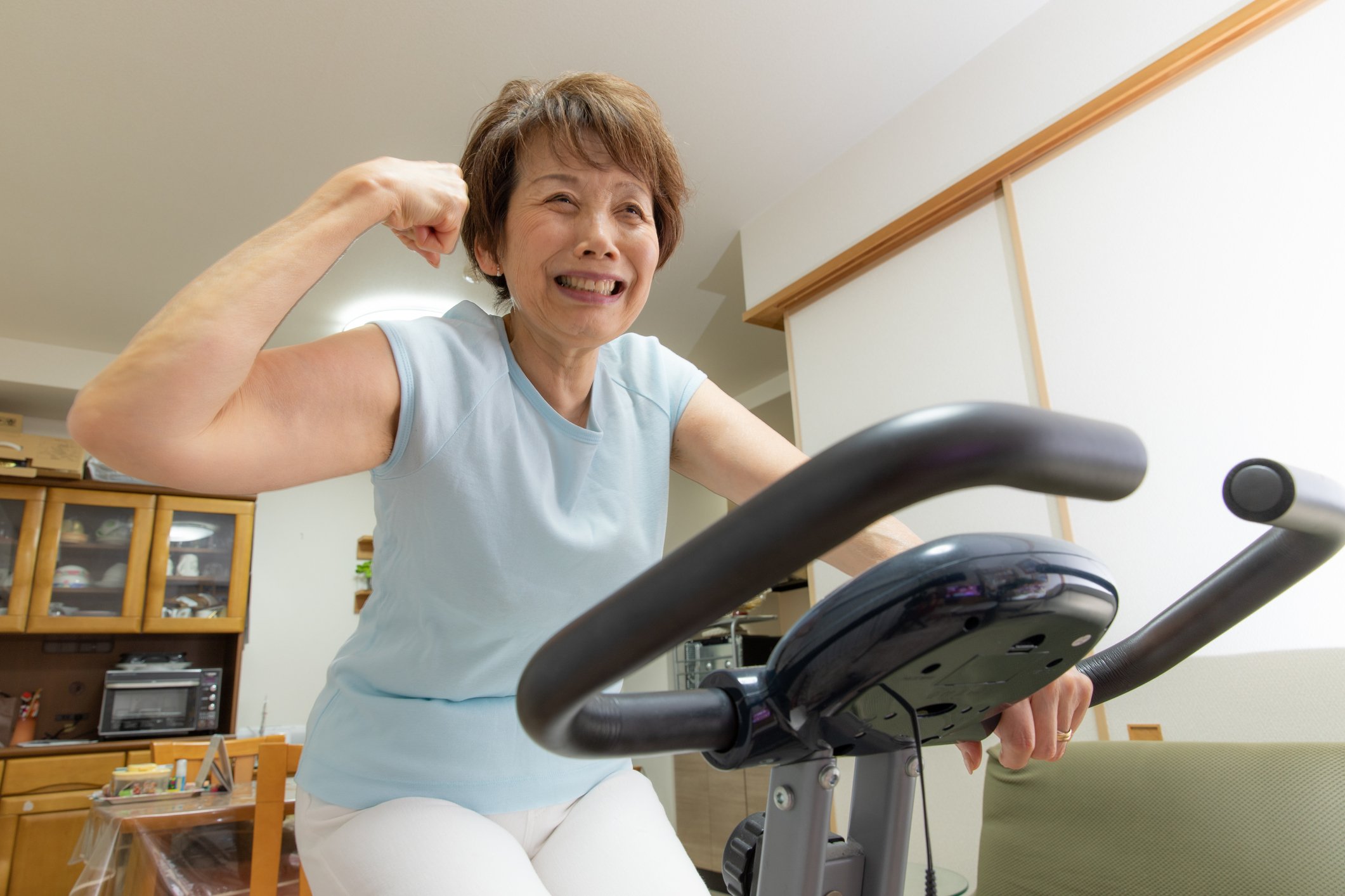 Woman on home exercise bike.