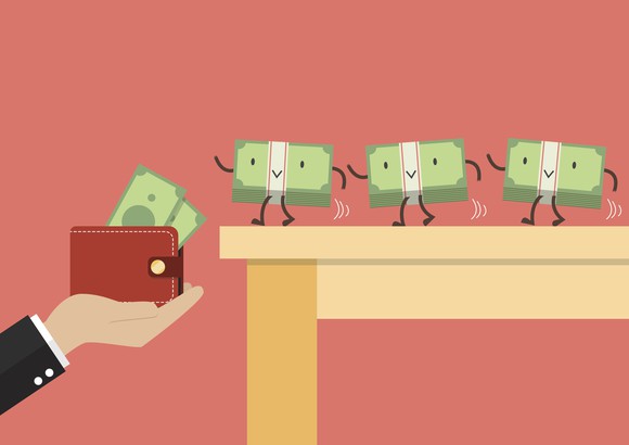 Money walking into wallet.