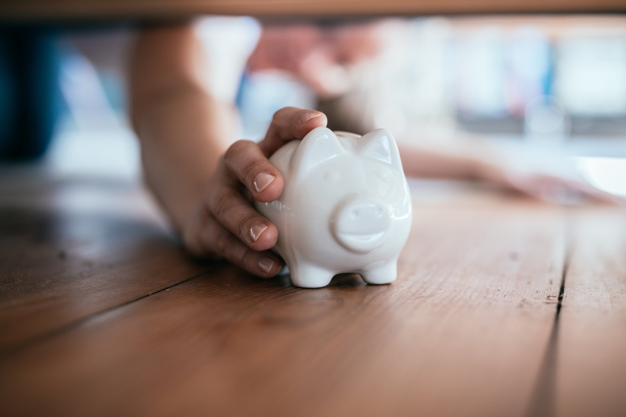 finding a piggy bank under the sofa