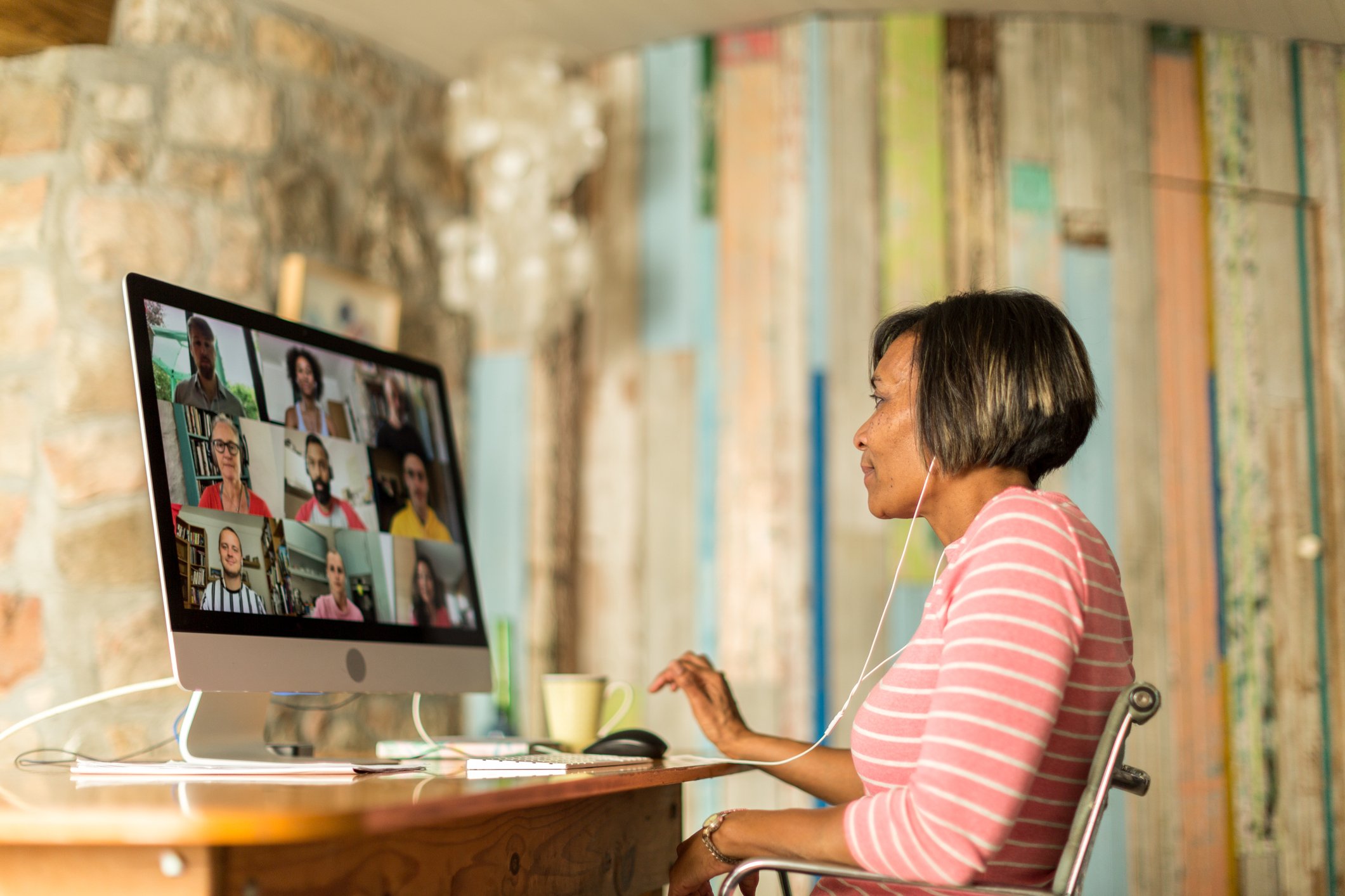 A woman attends a group video call.