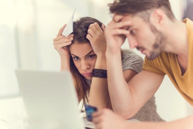 Two young people looking at computerWORRY