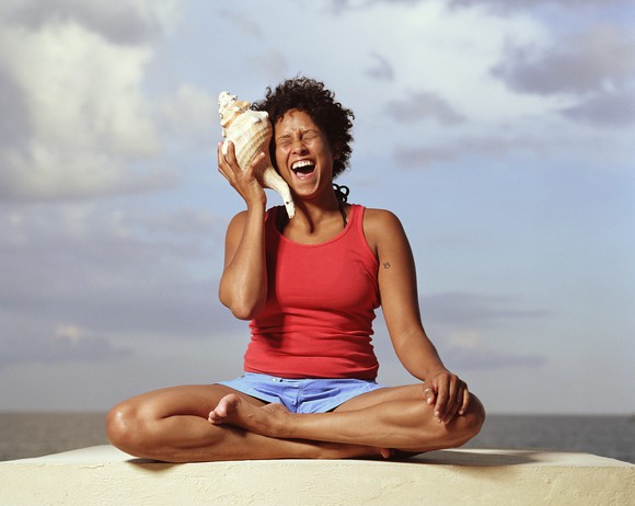 person sitting. shell to ear.