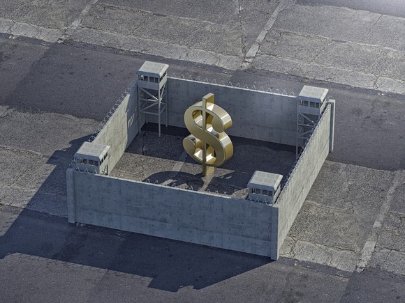 A dollar sign inside of a fortress.