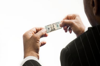 Man holding small dollar