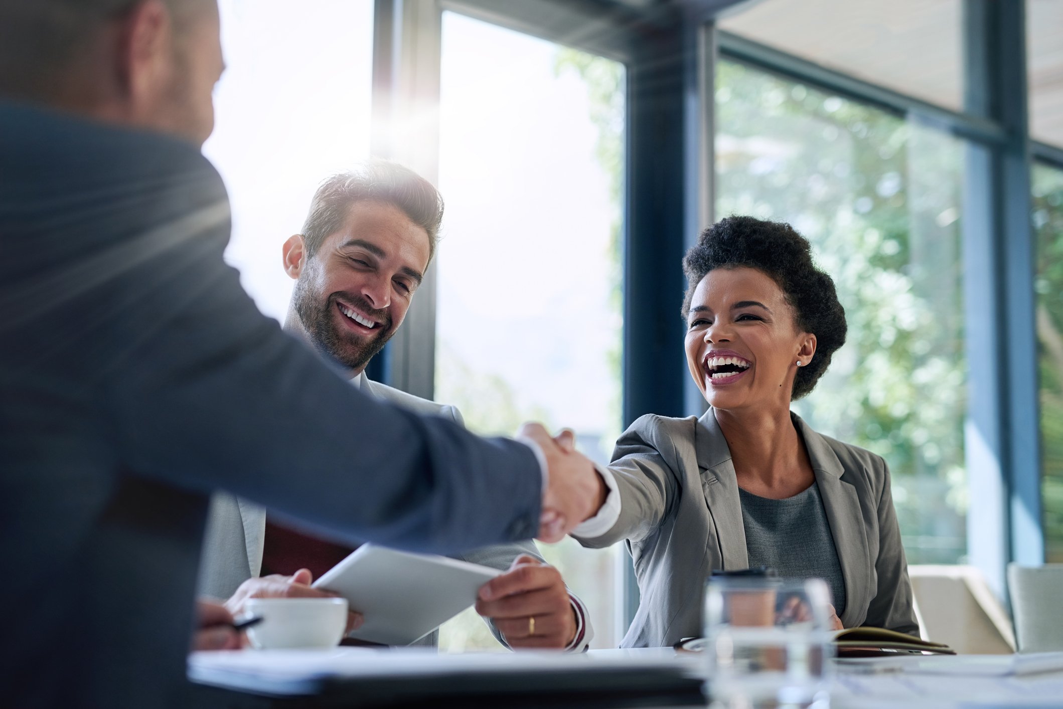 GettyImages-shaking hands in business meeting