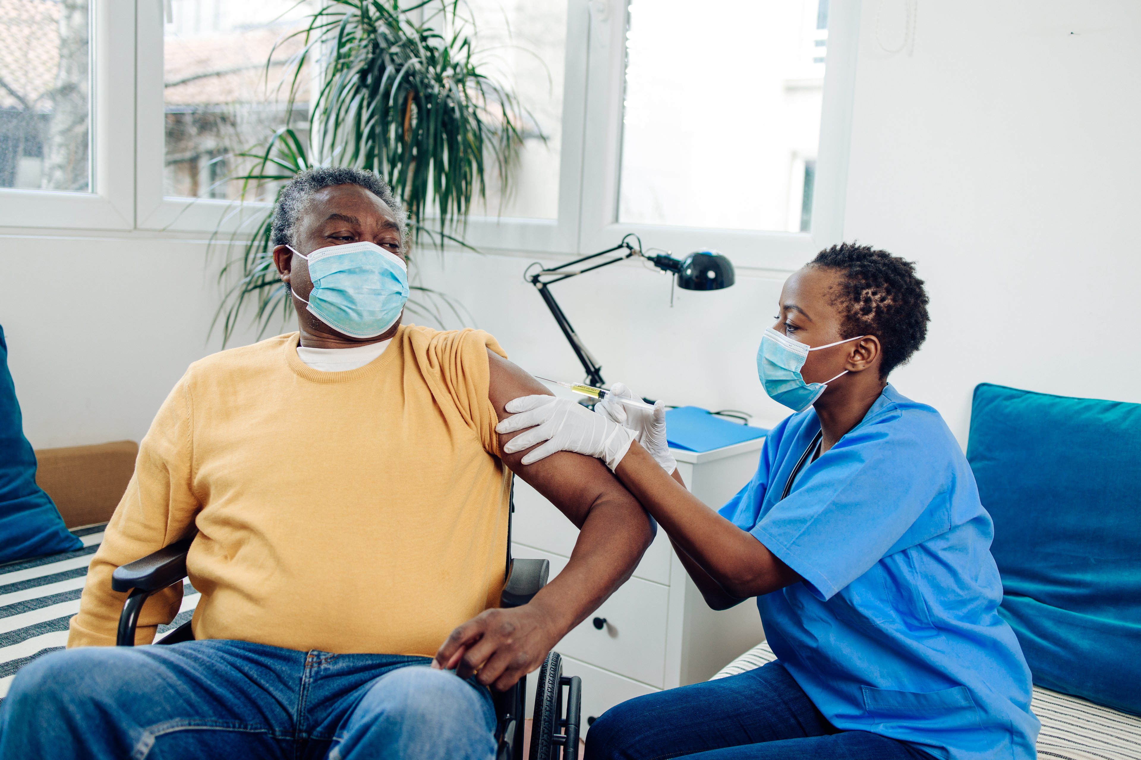 Man receiving a coronavirus shot at the clinic. 