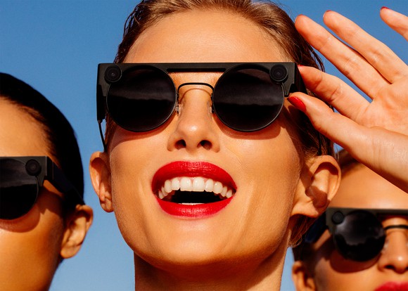 Three people are wearing Snap's Spectacles 3 in an outdoor setting.