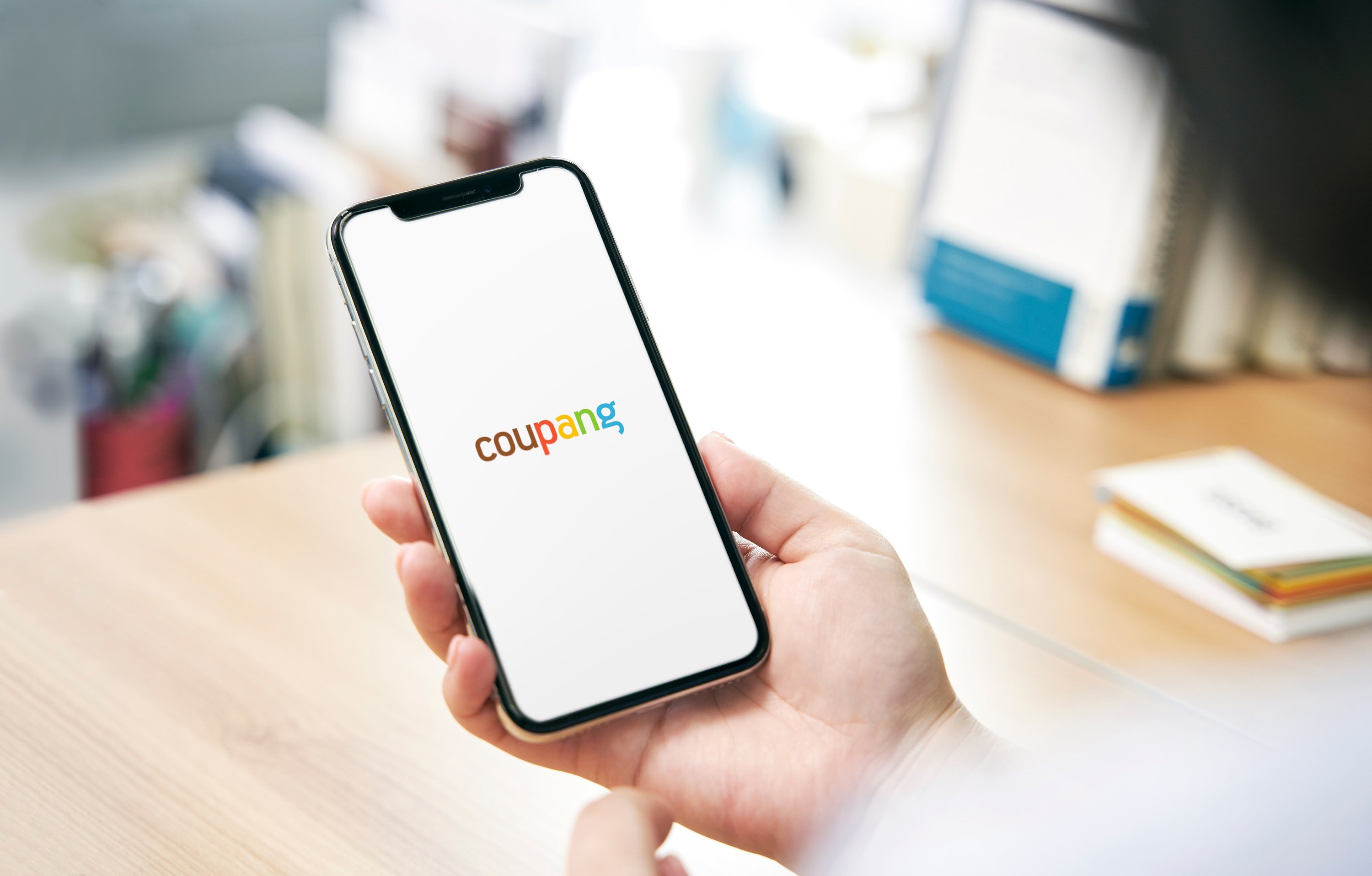 A smartphone showing the Coupang app. 