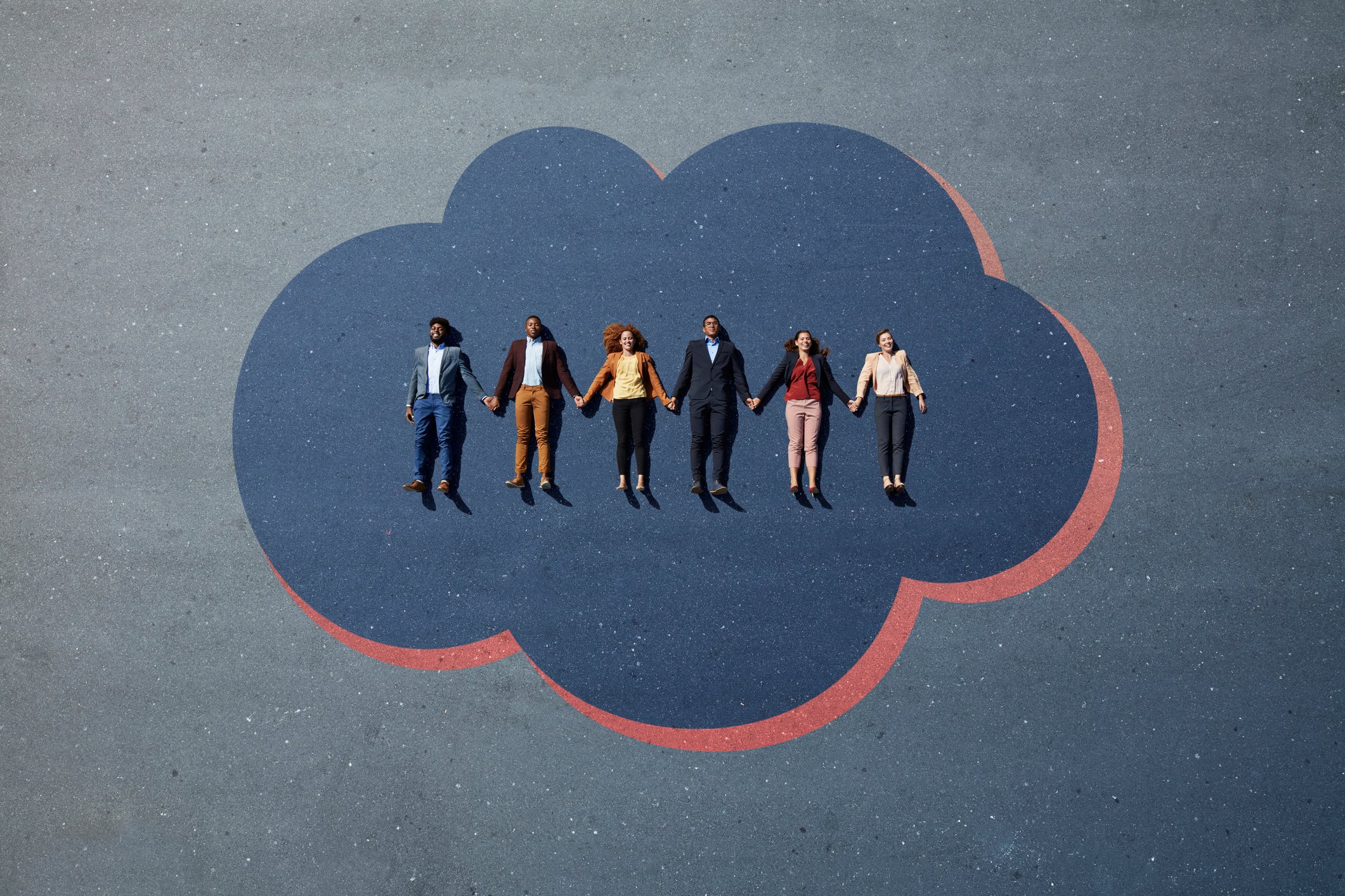 Six people lie inside an painting of a cloud.