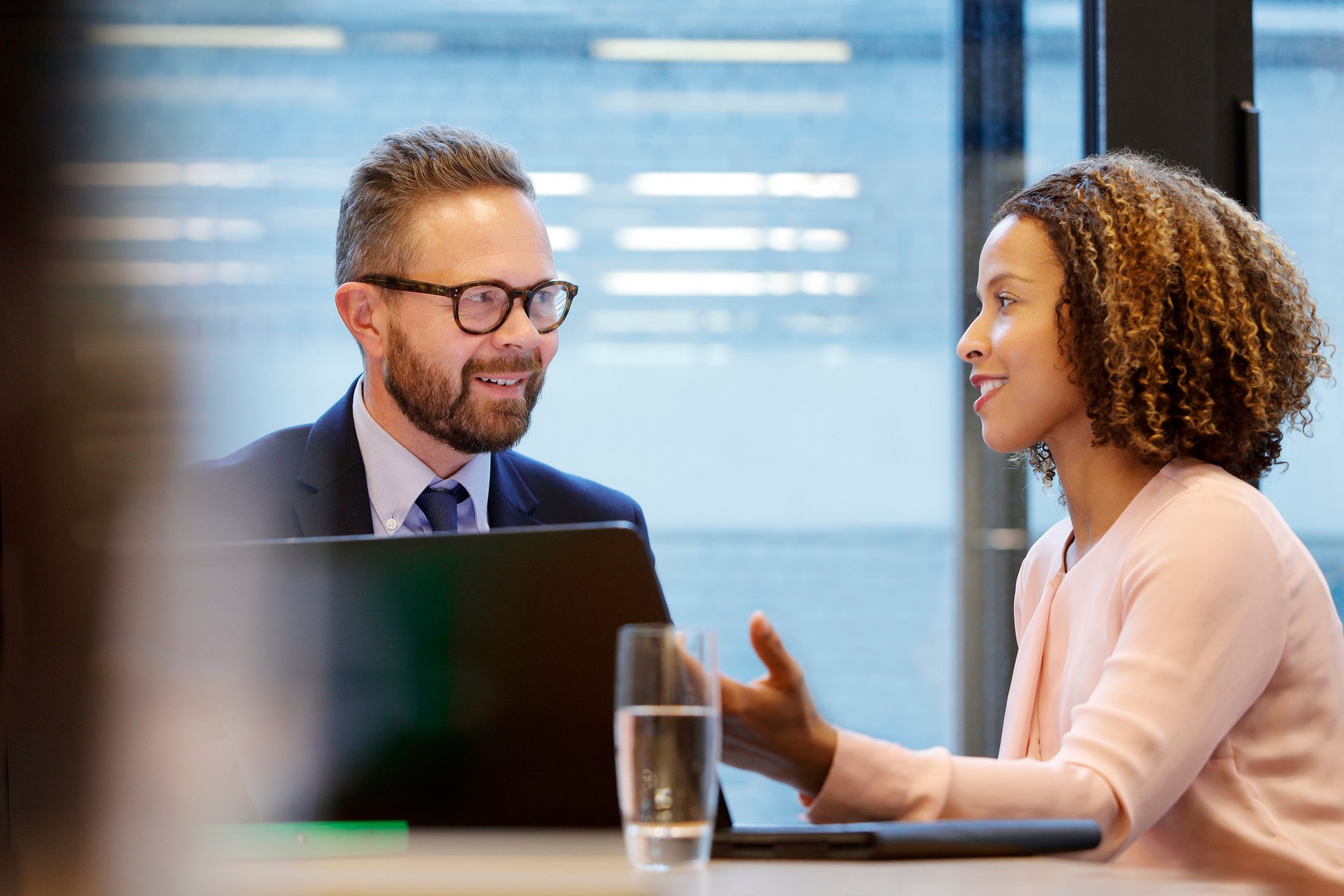 Two bank executives confer.