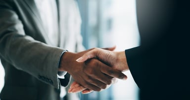 Handshake between 2 people