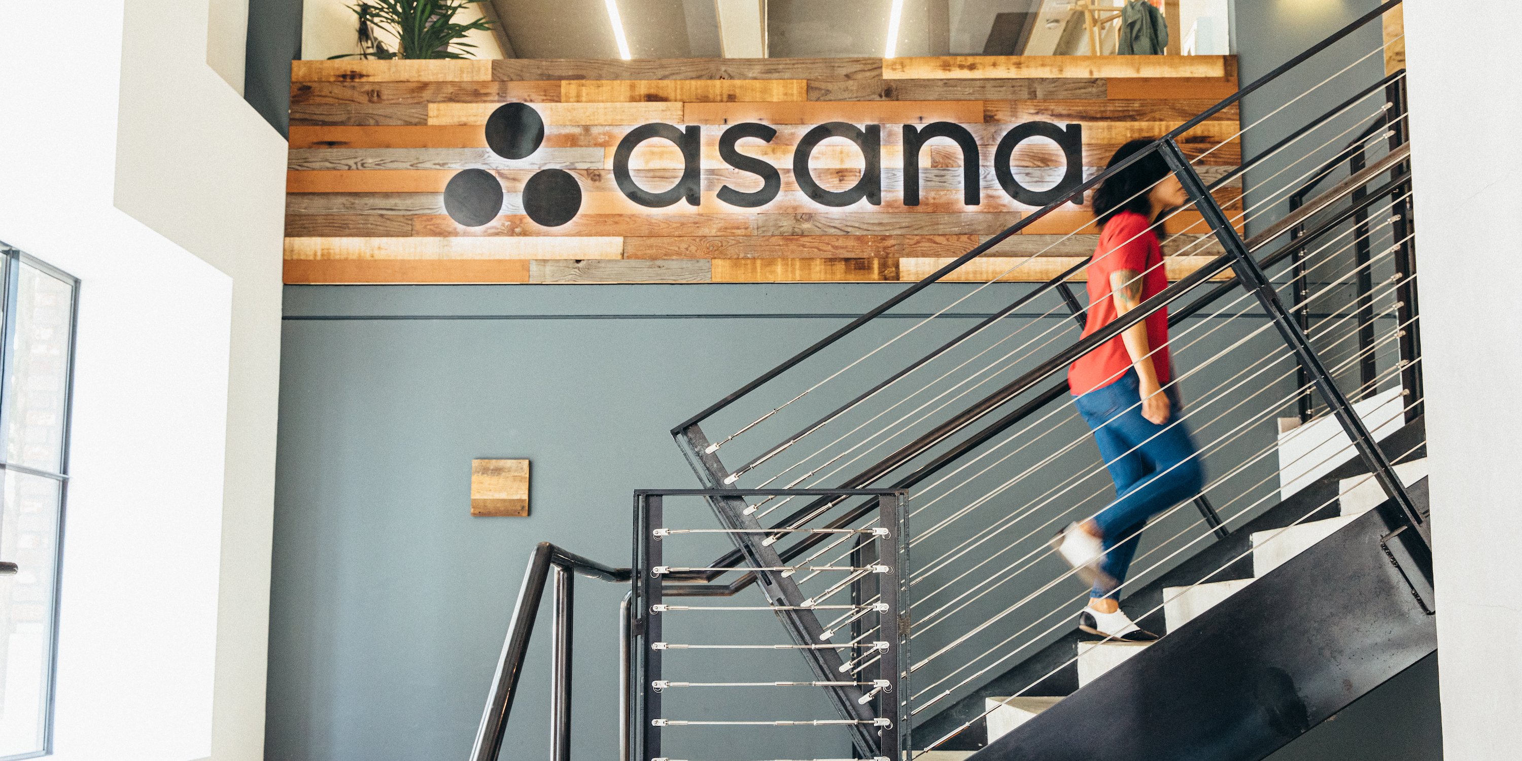 Person walking up stairs at Asana headquarters