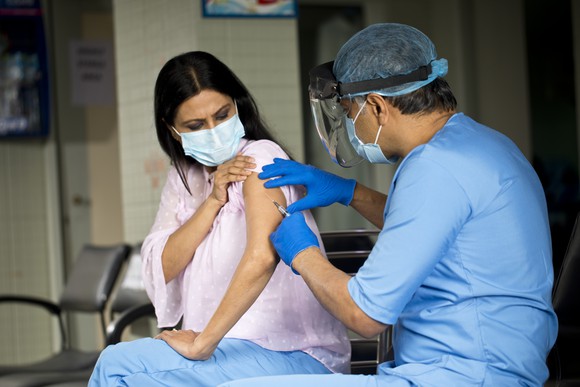 Indian doctor injects patient with COVID-19 vaccine