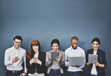 People looking at phones, iPads,and laptops