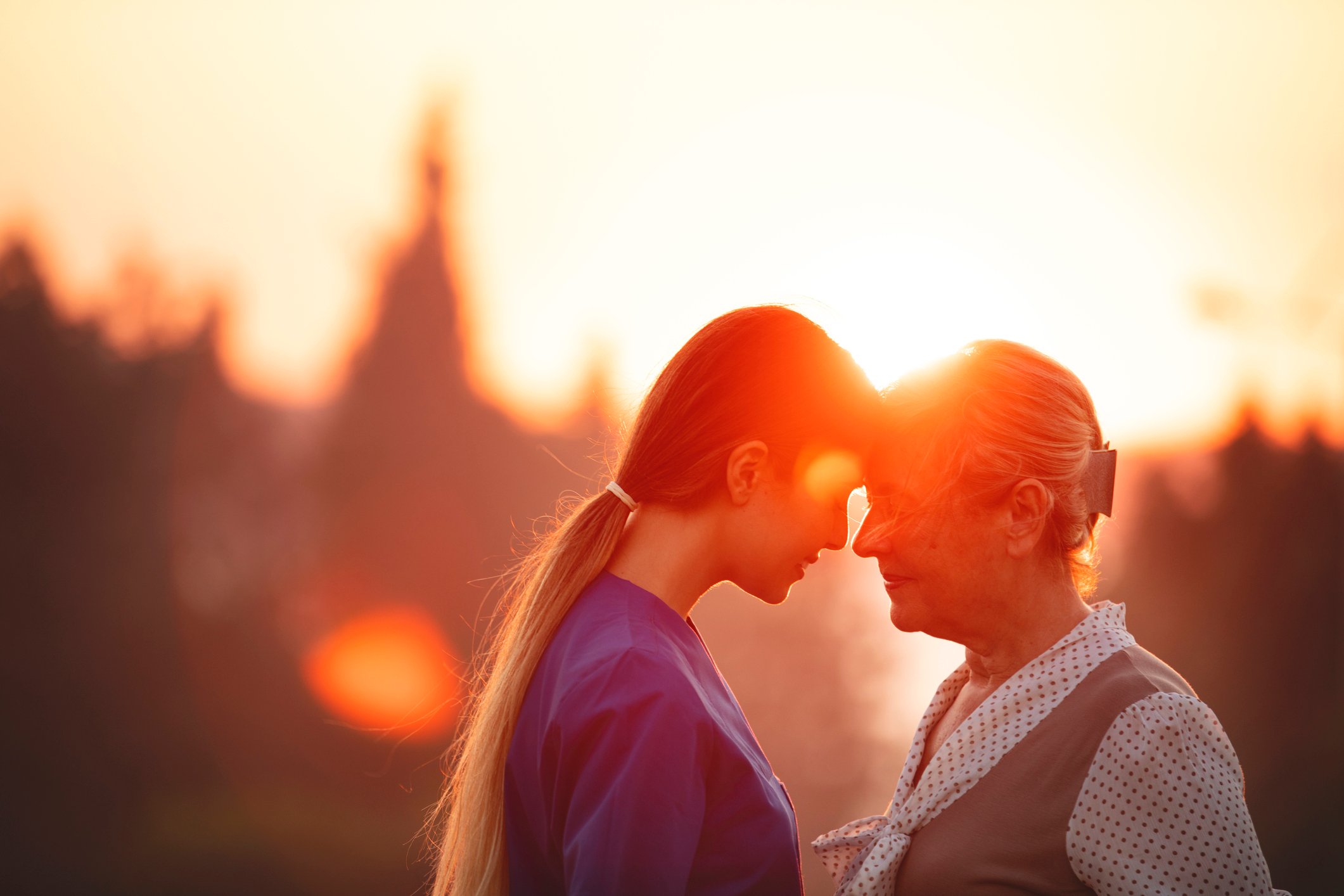 A daughter comforting her mother. 