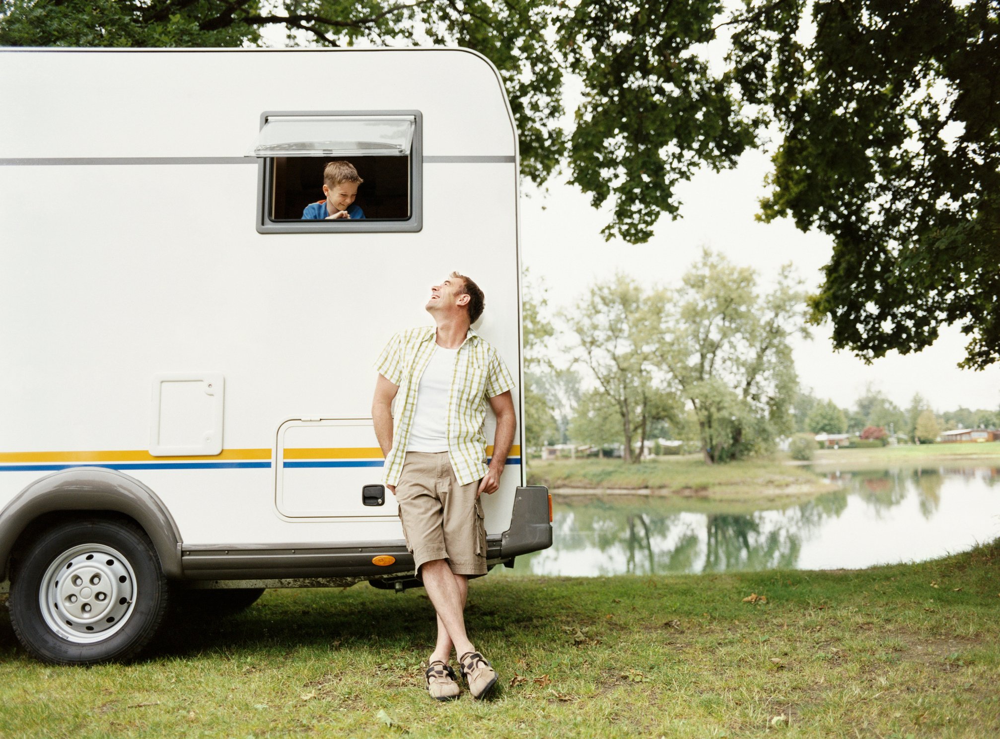 A man standing beside an RV.