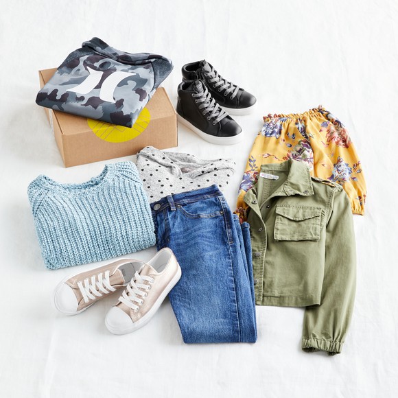 various clothing items from Stitch Fix's spring 2021 collection are arranged on a white background