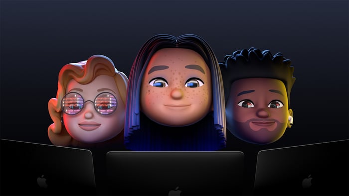 Three cartoon-like people looking at laptops.