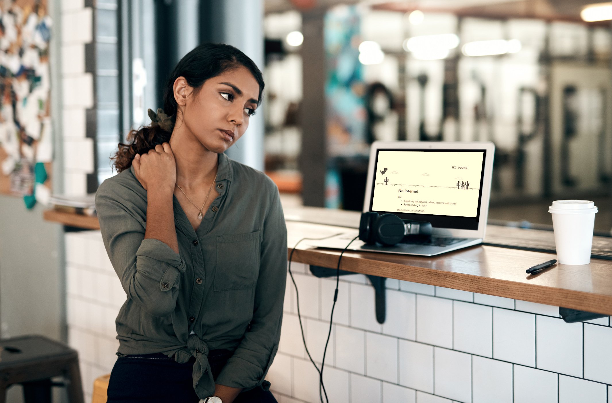 A woman's laptop has no internet connection.