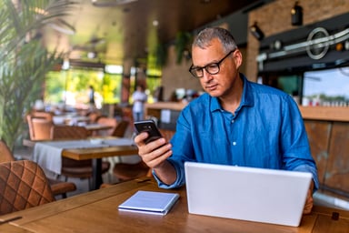 GettyImages-responding to alert on mobile device