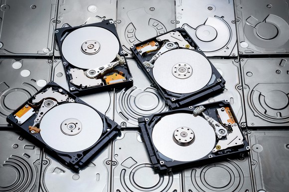 Four platter-based hard disk drives.