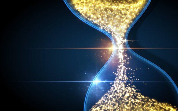 An hourglass filled with gold flakes.