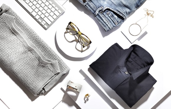 Fashion items on display on a table. 