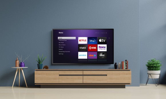 A TV displaying the Roku homescreen.