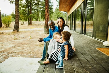 GettyImages-family on porch at a cabin