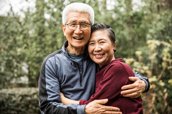 Older couple smiling and hugging