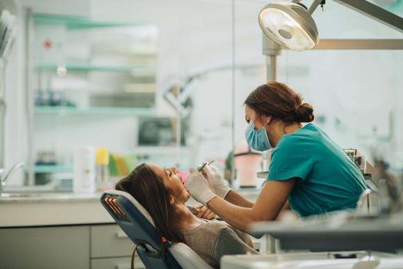 A dentist working on a patient.