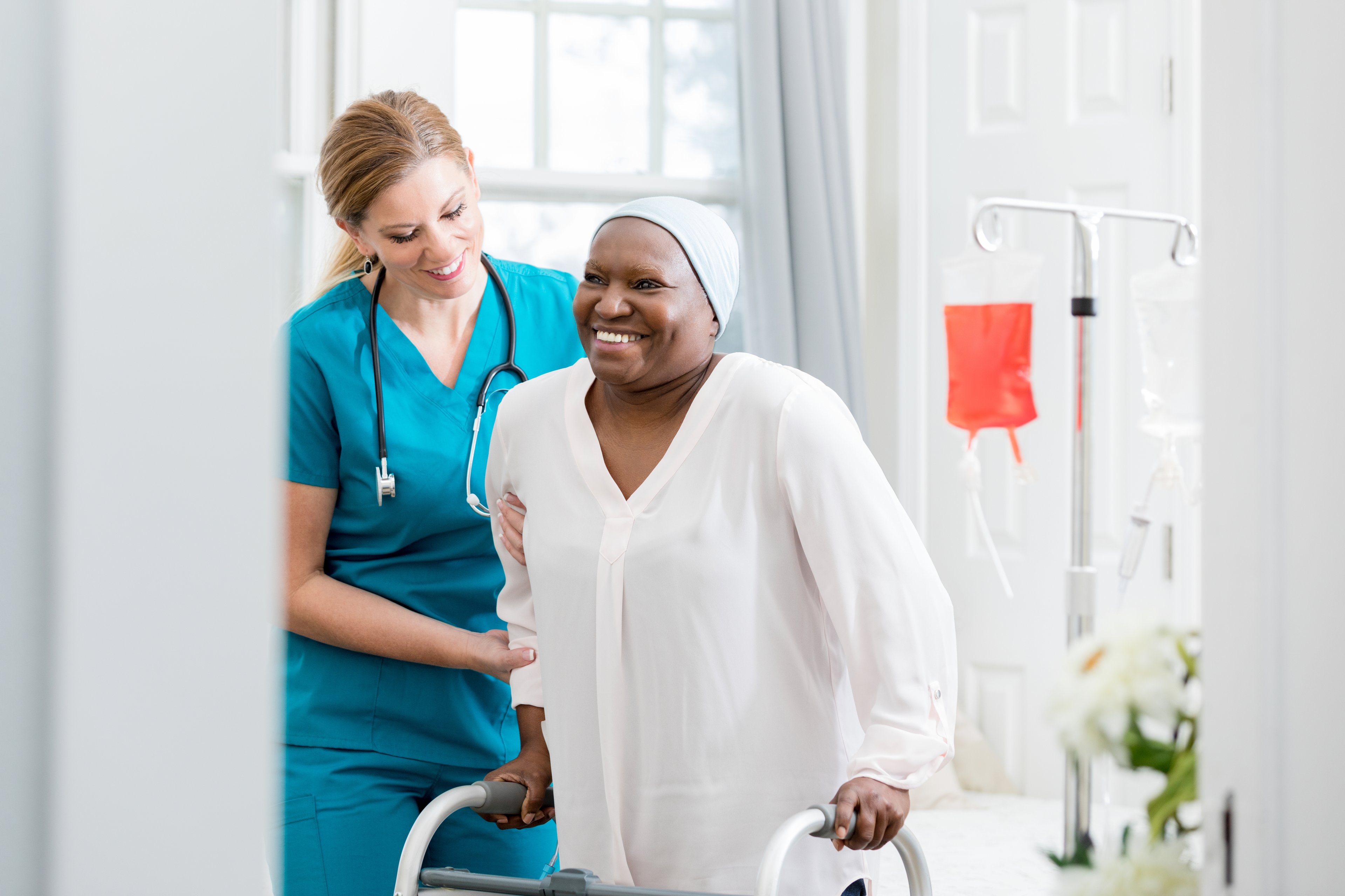 Nurse assisting cancer patient. 