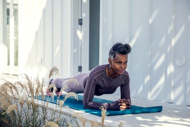 A woman doing yoga on a yoga mat