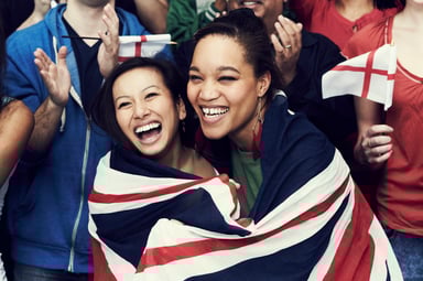 Two Women Wrapped in UK Flag