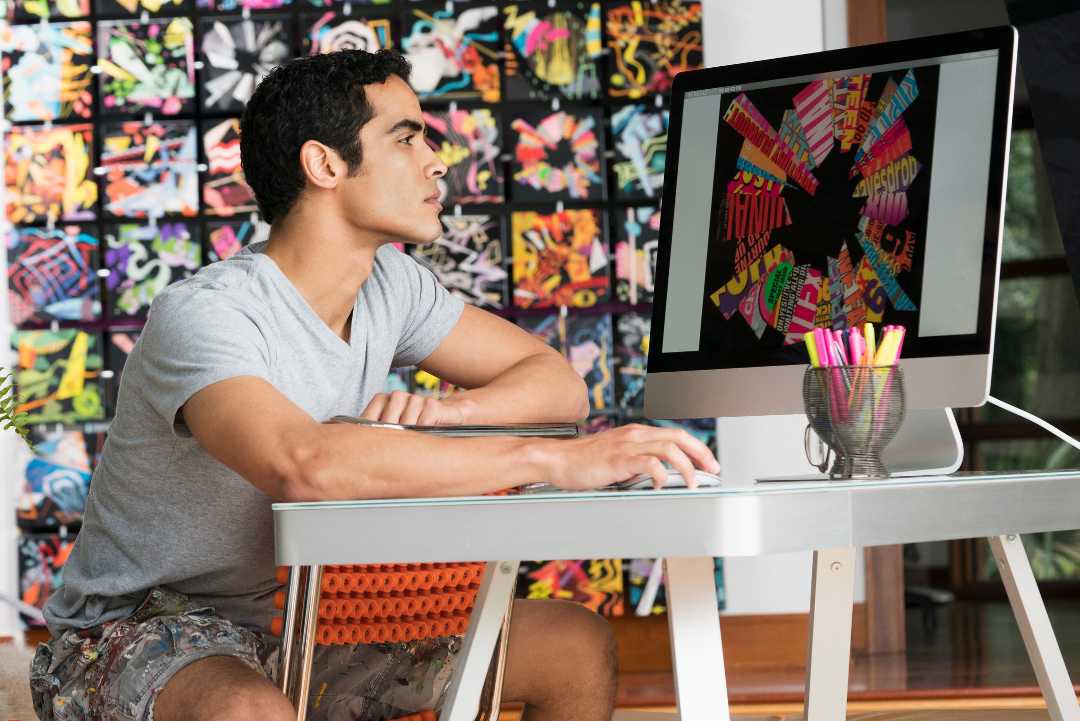 A person edits a photo on a computer.