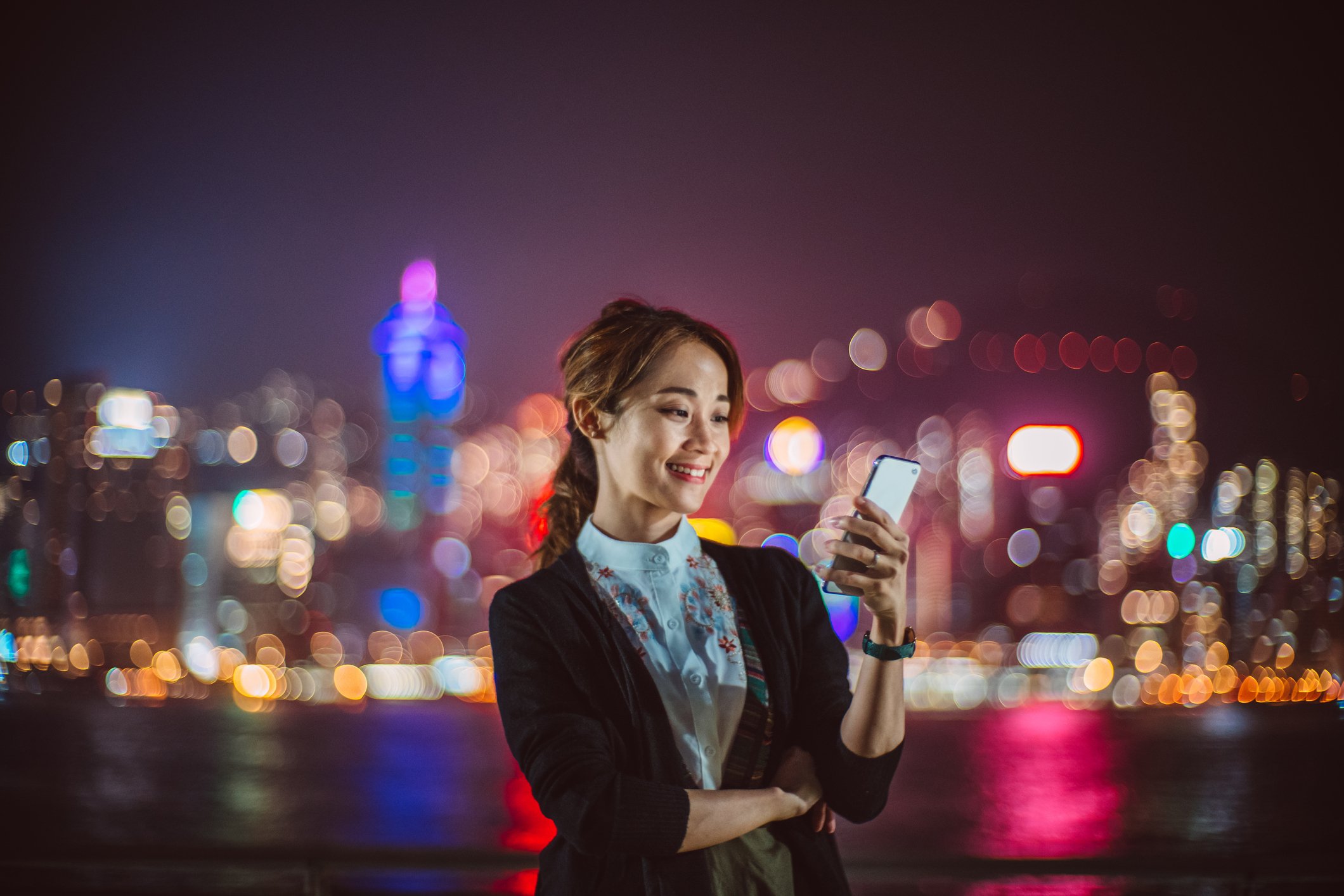 A person using a smartphone in Hong Kong.