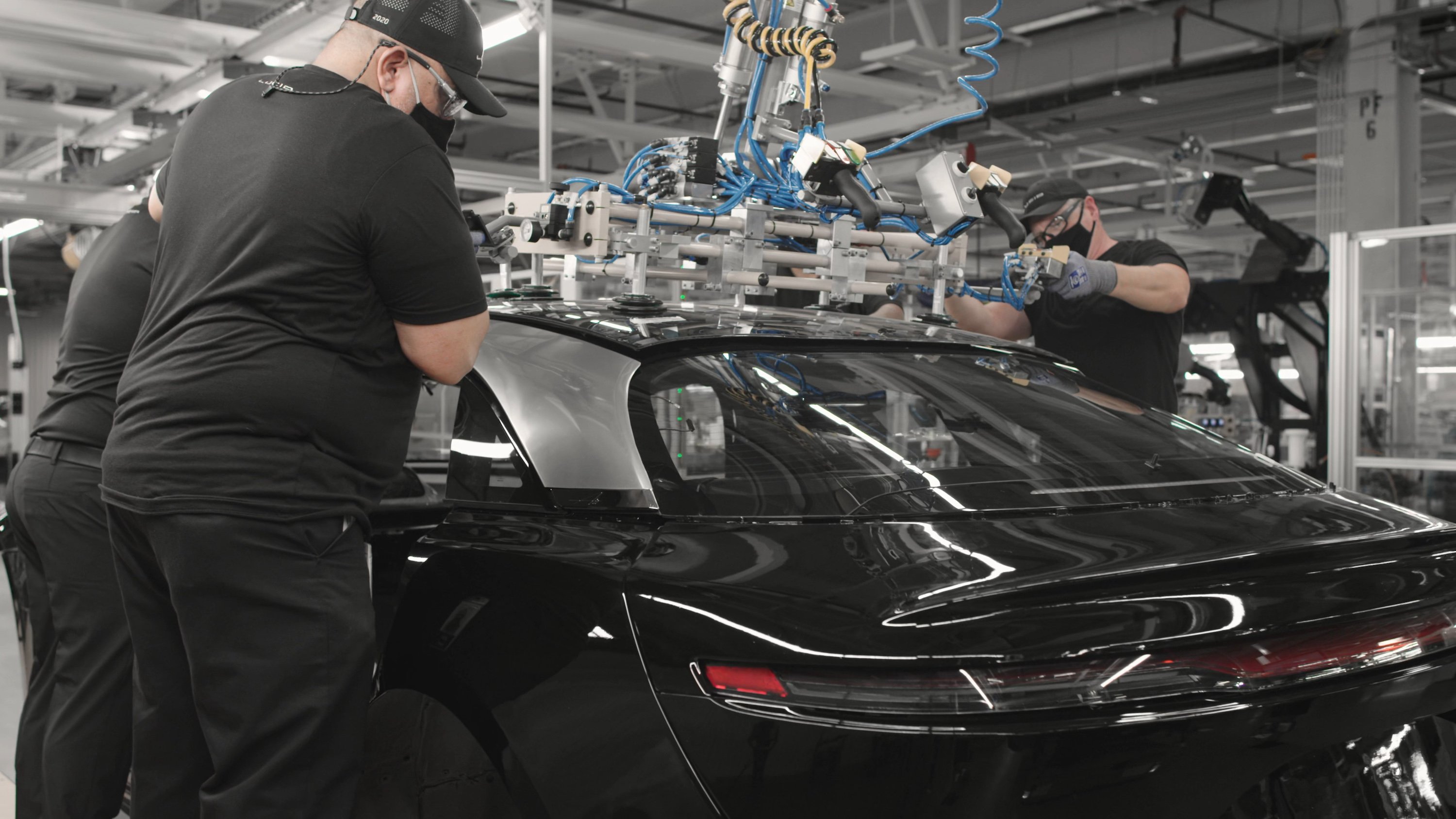 Workers assembling a Lucid Air sedan