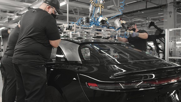 Workers assembling a Lucid Air sedan