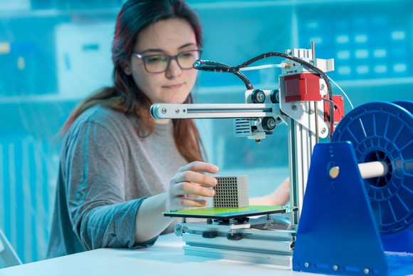 A person designing a metamaterial block. 