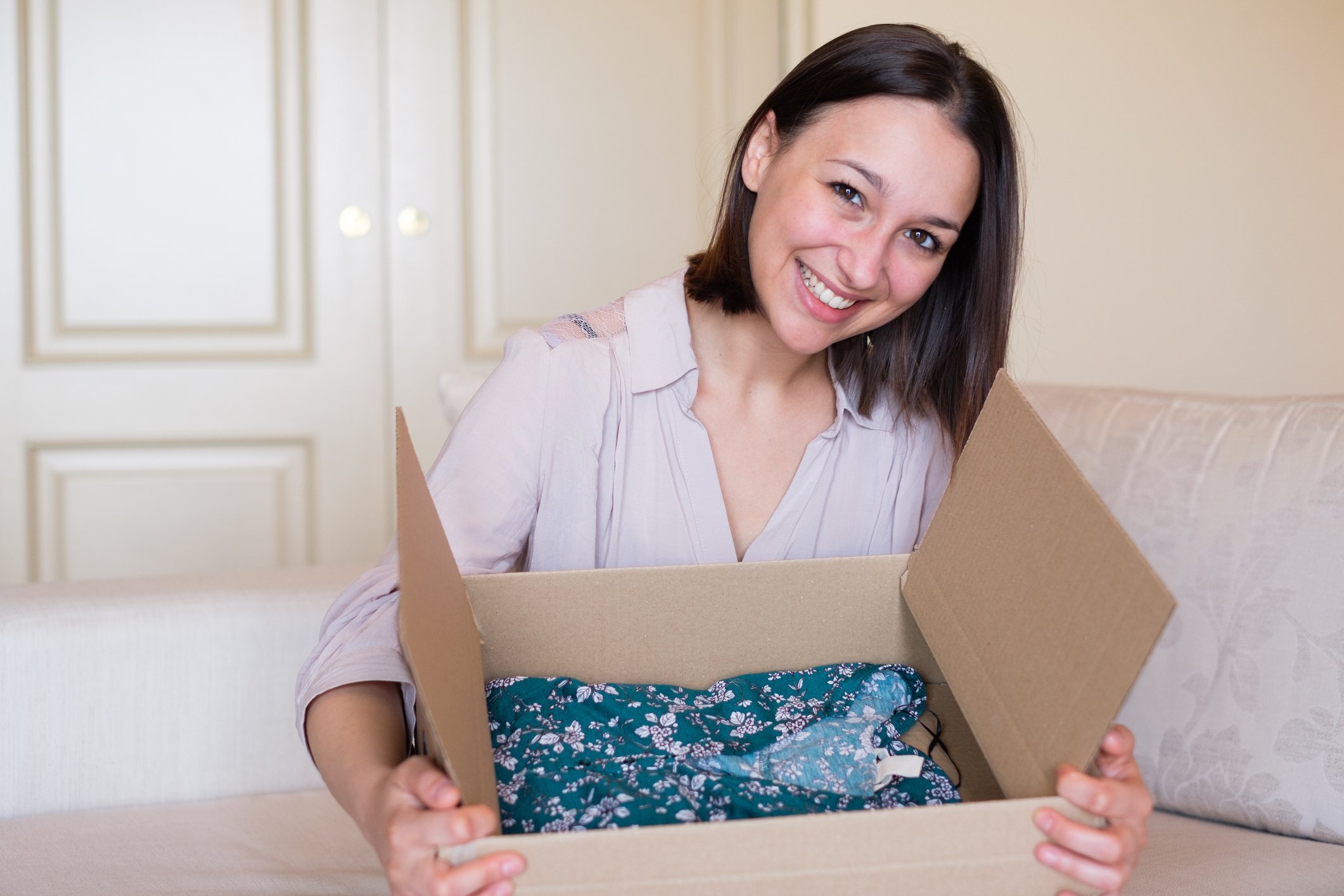 Woman hold box of clothes