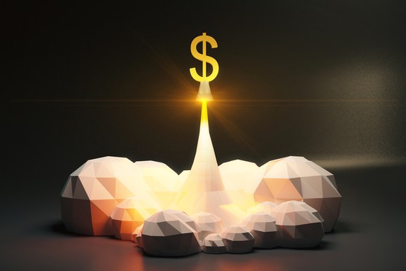 A dollar sign blasting off like a rocket.