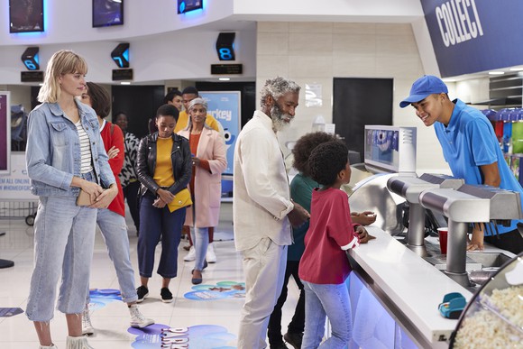 Customers ordering food and drinks.