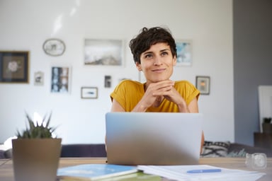 Smiling person at laptop_GettyImages-1092323308